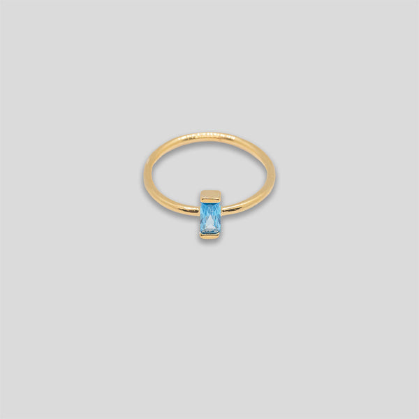 Coo Coo: Coo Coo: Cross Bar Diamante Ring - Gold/Sky Blue